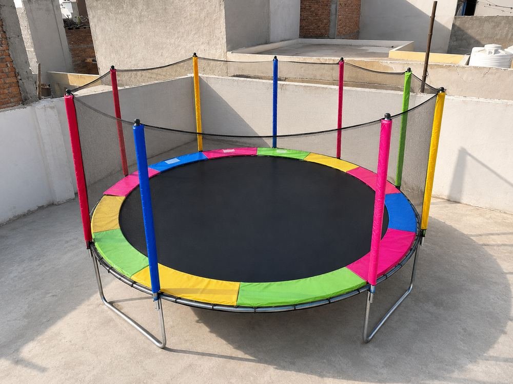 Colourful trampoline with safety net at Anokha Gaon